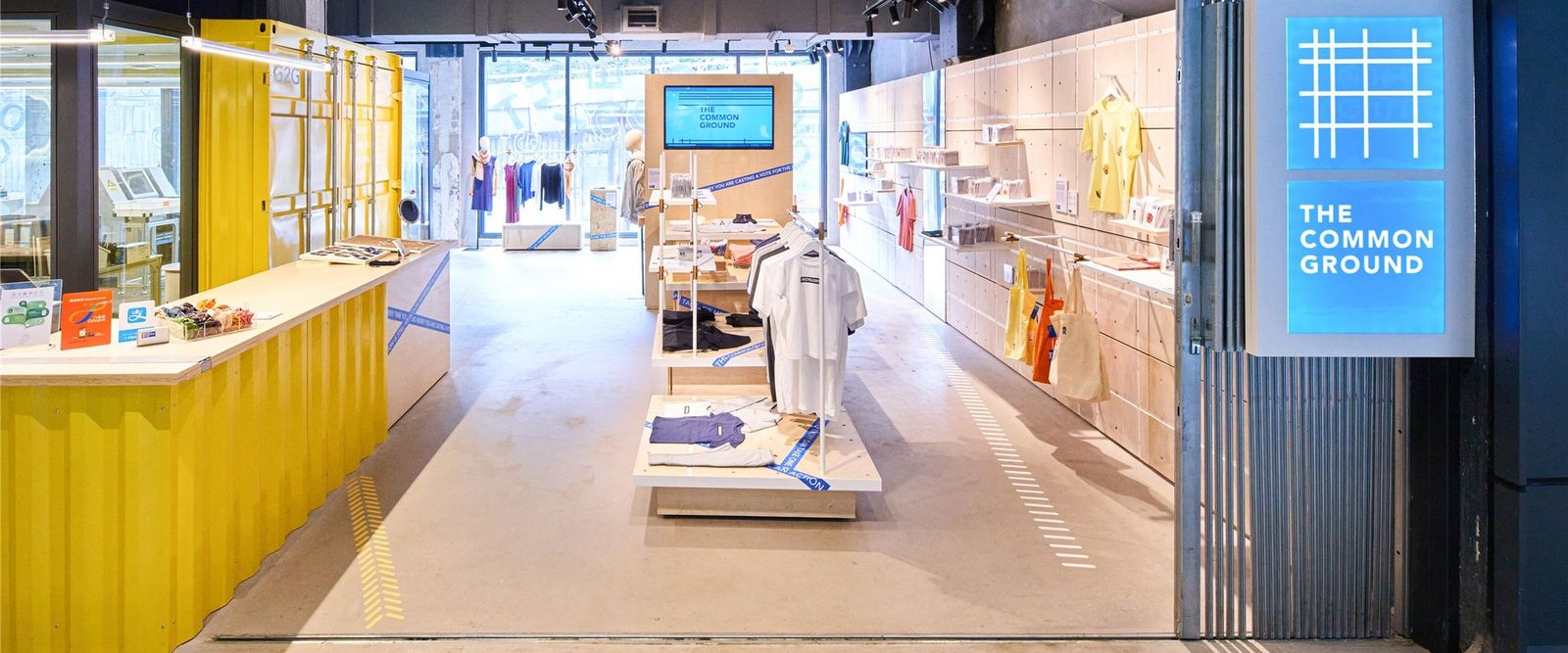 The Common Ground at The Mills: store entrance with yellow counter and rails